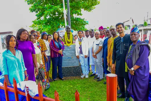 A club photograph of the members gathered in front of the bust and plaques at Patel Park.