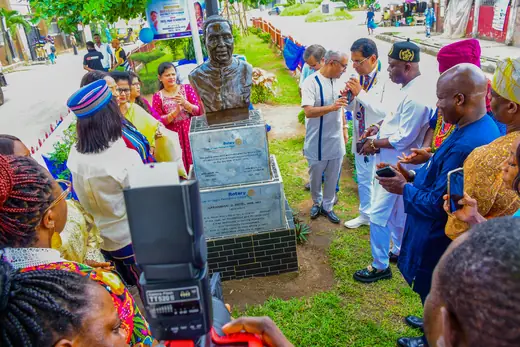 The address to the gathering, given beside the bust with a public address speaker alongside.